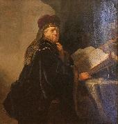 REMBRANDT Harmenszoon van Rijn A Scholar Seated at a Desk oil on canvas